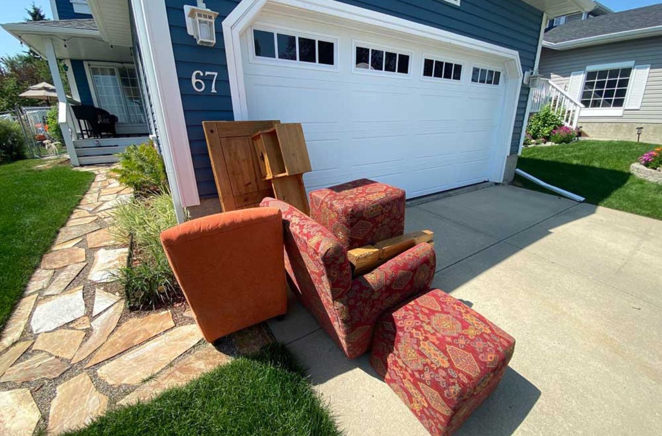 A satisfied homeowner enjoying a clutter-free yard after BE&P Services’ eco-friendly junk removal in Aspen Woods, AB.